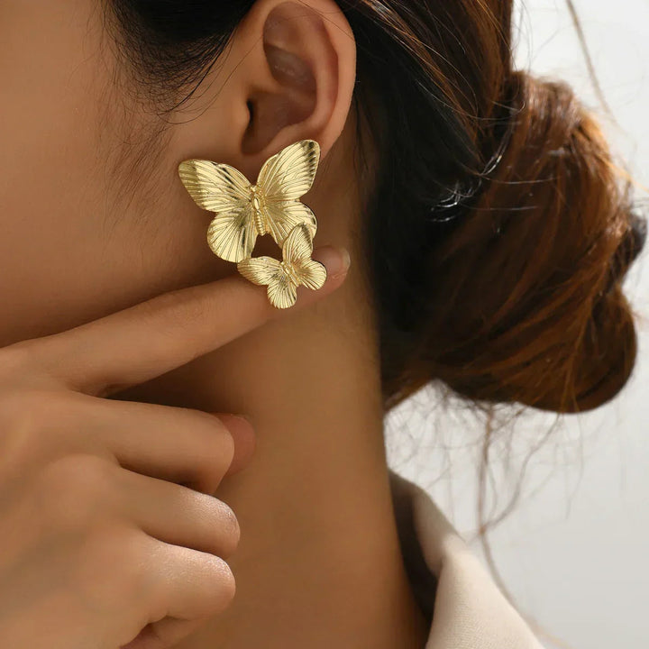 Boucles d'oreilles papillon en or